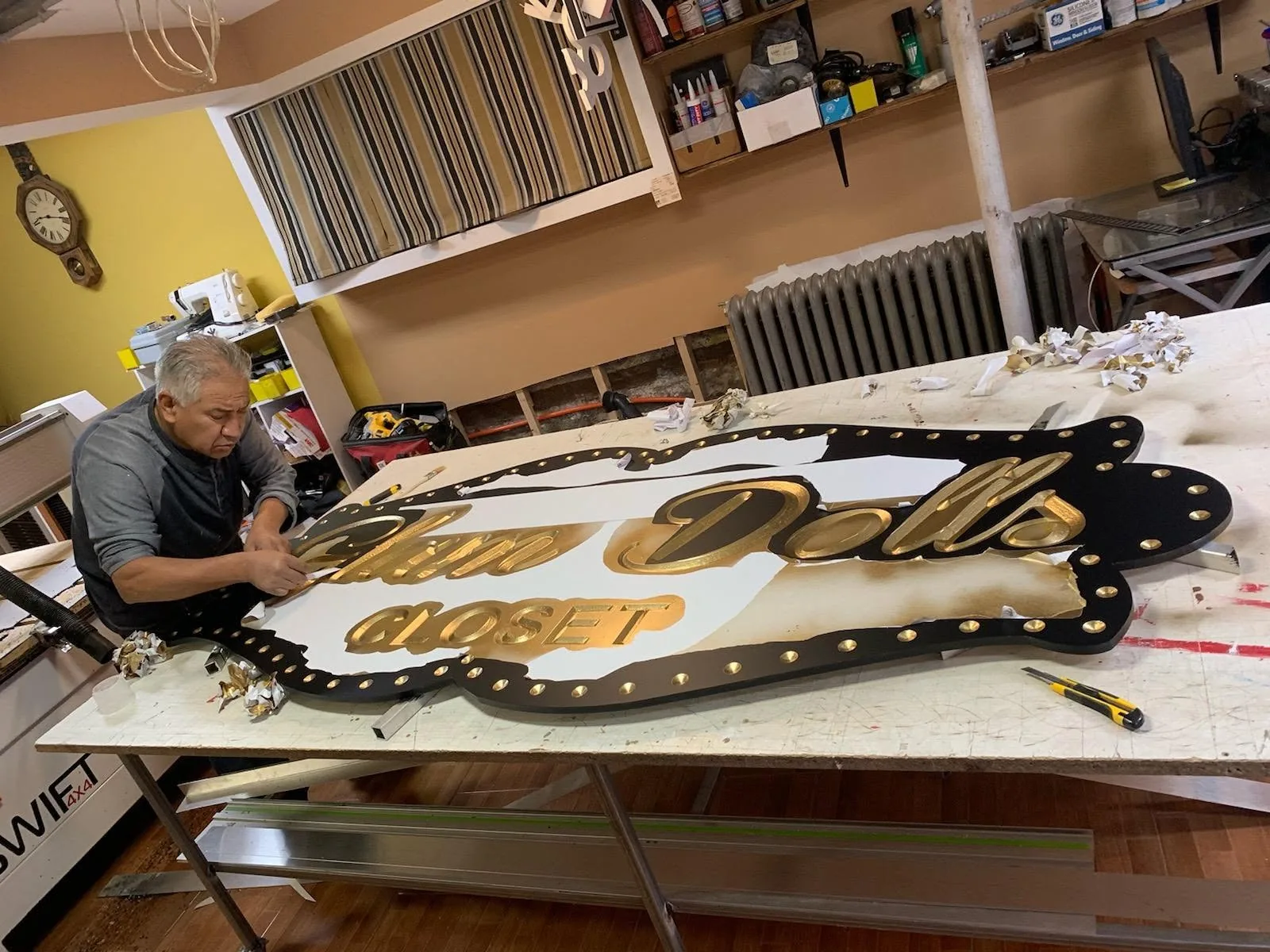 MD'Signs&Plus craftsman fabricating a custom sign in the workshop
